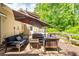 Back patio with a hot tub, lounge seating and mature landscaping, offering a private space at 4281 Chimney Lake Ne Dr, Roswell, GA 30075
