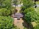 An aerial view showing the home nestled within a canopy of mature trees and large backyard at 4356 Executive Dr, Stone Mountain, GA 30083