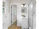 Updated bathroom featuring a shower and a white vanity with a modern faucet at 4356 Executive Dr, Stone Mountain, GA 30083