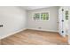 Bedroom with neutral walls, hardwood floors and a window overlooking a green yard at 4356 Executive Dr, Stone Mountain, GA 30083