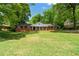 Charming brick home featuring a well-manicured lawn and inviting curb appeal at 4356 Executive Dr, Stone Mountain, GA 30083
