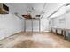 Garage featuring a concrete floor, overhead lighting and a white door at 4356 Executive Dr, Stone Mountain, GA 30083
