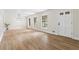 Open-concept living room with new laminate floors, freshly painted walls and natural light at 4356 Executive Dr, Stone Mountain, GA 30083
