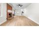 Open-concept living room with a brick fireplace, kitchen, and plenty of natural light at 4356 Executive Dr, Stone Mountain, GA 30083