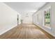 Spacious living room with new laminate floors and lots of natural light at 4356 Executive Dr, Stone Mountain, GA 30083
