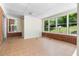Bright sunroom featuring tile flooring and multiple windows overlooking the backyard at 4356 Executive Dr, Stone Mountain, GA 30083