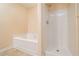 Clean bathroom with a walk-in shower and a separate soaking tub at 5485 Sierra Trl, Atlanta, GA 30349