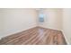 Empty bedroom with window and hardwood flooring at 5485 Sierra Trl, Atlanta, GA 30349