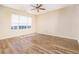 Bright bedroom with generous natural light from large windows and wood-look flooring at 5485 Sierra Trl, Atlanta, GA 30349