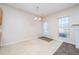 Cozy breakfast area featuring tile and carpet flooring, a window, and access to the outdoors at 5485 Sierra Trl, Atlanta, GA 30349