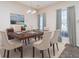 Elegant dining room with a chandelier, stylish curtains, and a wooden table set for a sophisticated meal at 5485 Sierra Trl, Atlanta, GA 30349