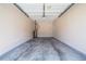 Spacious garage with concrete floor and overhead door, ideal for parking and storage at 5485 Sierra Trl, Atlanta, GA 30349