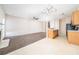Bright open living area with fireplace, ceiling fan and adjacent kitchen at 5485 Sierra Trl, Atlanta, GA 30349