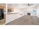 Open-concept living area featuring a fireplace, seamlessly connected to the kitchen with a breakfast bar at 5485 Sierra Trl, Atlanta, GA 30349