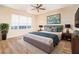 Comfortable main bedroom featuring a ceiling fan, plenty of natural light, and a neutral color scheme at 5485 Sierra Trl, Atlanta, GA 30349