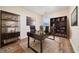 Home office with modern furniture, bookshelves, and natural light at 5485 Sierra Trl, Atlanta, GA 30349