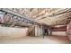 This unfinished basement with exposed beams offers an open canvas for future living space at 8491 Limerick Ln, Winston, GA 30187