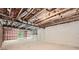 Unfinished basement with exposed ducts and natural light awaiting customization at 8491 Limerick Ln, Winston, GA 30187
