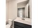 Bathroom with a sleek vanity, undermount sink, and modern fixtures at 8491 Limerick Ln, Winston, GA 30187