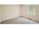Cozy bedroom with soft carpeting and a window offering a view of the outdoors at 8491 Limerick Ln, Winston, GA 30187