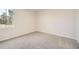 This bedroom with fresh paint, neutral carpet, and a bright window offers a clean slate at 8491 Limerick Ln, Winston, GA 30187