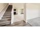 Welcoming entryway with staircase and blend of carpet and hardwood flooring at 8491 Limerick Ln, Winston, GA 30187
