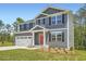 Two-story home featuring gray siding, black shutters, and a well-manicured lawn at 8491 Limerick Ln, Winston, GA 30187