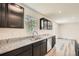 Modern kitchen with granite countertops, stainless steel sink, and ample cabinet space for storage at 8491 Limerick Ln, Winston, GA 30187