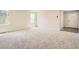 A bright living room with large windows and neutral carpeting at 8491 Limerick Ln, Winston, GA 30187