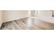 Open-concept with sleek hardwood flooring transitioning into plush carpeting, bright interior at 8491 Limerick Ln, Winston, GA 30187