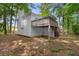 Backyard featuring a porch, wooded backdrop and ground cover, offering a blend of nature and outdoor space at 223 Old Alabama Se Rd, Emerson, GA 30137