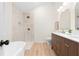 Bathroom with a walk-in shower, soaking tub, double sinks, and modern lighting at 223 Old Alabama Se Rd, Emerson, GA 30137