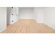 This bedroom features light, wood-look floors and white walls with doors, creating a bright, neutral space at 223 Old Alabama Se Rd, Emerson, GA 30137