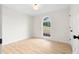 Neutral bedroom with wood floors and a large window at 223 Old Alabama Se Rd, Emerson, GA 30137
