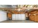 Spacious garage with exposed insulation in the ceiling and a white garage door, perfect for storage and projects at 223 Old Alabama Se Rd, Emerson, GA 30137