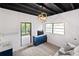 Finished basement includes seating, storage, and a stylish modern light fixture at 2342 Eastway Rd, Decatur, GA 30033