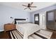 Stylish bedroom features a ceiling fan, barn door entry, and a comfortable queen-sized bed at 2342 Eastway Rd, Decatur, GA 30033
