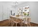 Bright dining area with modern light fixture, and views into living room and through the window shelves at 2342 Eastway Rd, Decatur, GA 30033