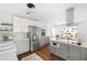 Spacious kitchen with stainless steel appliances, gray cabinetry, quartz countertops and stylish lighting at 2342 Eastway Rd, Decatur, GA 30033