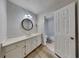 Bathroom features a single sink vanity with white countertop and views of a separate shower and bath at 2976 Matthew Ln, Lawrenceville, GA 30044