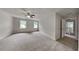 Spacious carpeted bedroom with neutral walls, a ceiling fan and two windows for great natural light at 2976 Matthew Ln, Lawrenceville, GA 30044