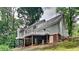 Charming home with a deck overlooking a spacious yard and lush trees at 2976 Matthew Ln, Lawrenceville, GA 30044