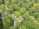 Aerial view of the home and the surrounding wooded neighborhood at 4514 Creekwood Nw Cir, Kennesaw, GA 30152