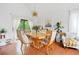 Elegant dining area with decorative light fixture, view to the backyard and modern decor at 4514 Creekwood Nw Cir, Kennesaw, GA 30152