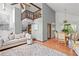 Open living space features soaring ceilings, a wooden staircase and neutral décor adjacent to a dining area at 4514 Creekwood Nw Cir, Kennesaw, GA 30152