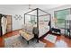 Comfortable primary bedroom with four poster bed, area rug, and room decor at 4514 Creekwood Nw Cir, Kennesaw, GA 30152