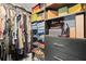 An organized walk-in closet featuring custom shelving, storage boxes, and sections for shoes and clothing at 4514 Creekwood Nw Cir, Kennesaw, GA 30152