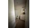 Bathroom with toilet, tub shower combo, and vanity featuring white cabinetry and a large mirror at 1466 Dolcetto Nw Trce # 18, Kennesaw, GA 30152