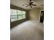 Large bedroom with large windows allowing natural light and a ceiling fan at 1466 Dolcetto Nw Trce # 18, Kennesaw, GA 30152