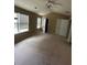 Expansive bedroom with neutral walls, carpet, a fan, and large windows for natural light at 1466 Dolcetto Nw Trce # 18, Kennesaw, GA 30152